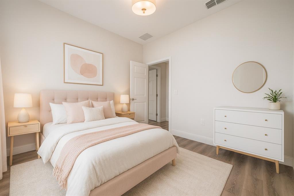 8922 Southwest 135th Street Road Ocala, FL 34473 - Photo 28 of 44 a bedroom with a bed and a dresser