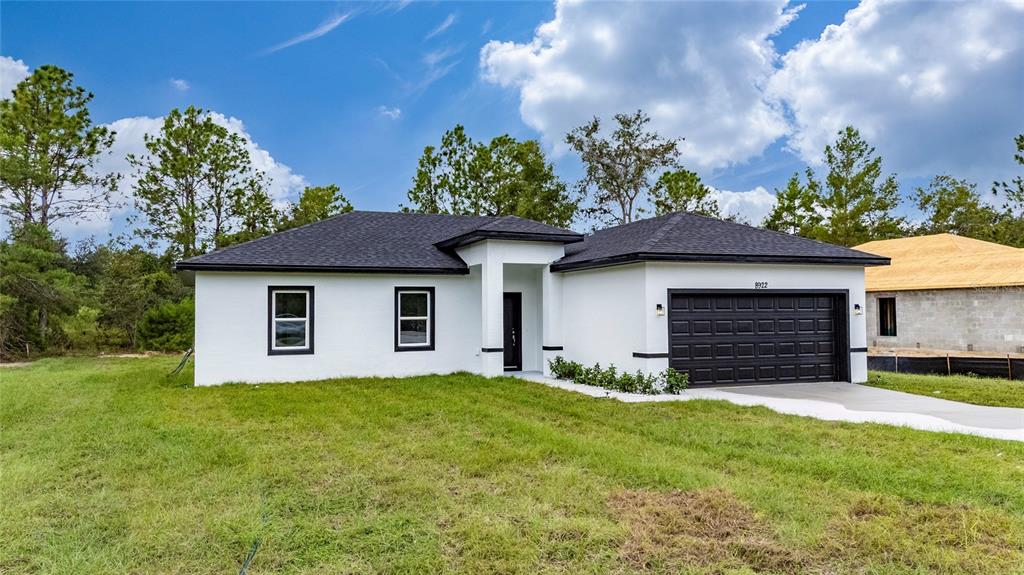 8922 Southwest 135th Street Road Ocala, FL 34473 - Photo 36 of 44 a house view with a garden space