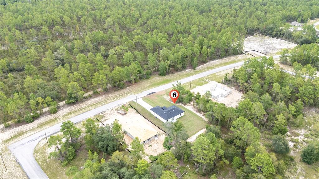 8922 Southwest 135th Street Road Ocala, FL 34473 - Photo 40 of 44 a view of a yard with an outdoor seating