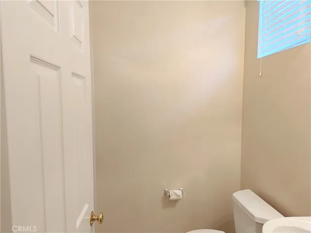 a bathroom with a white toilet
