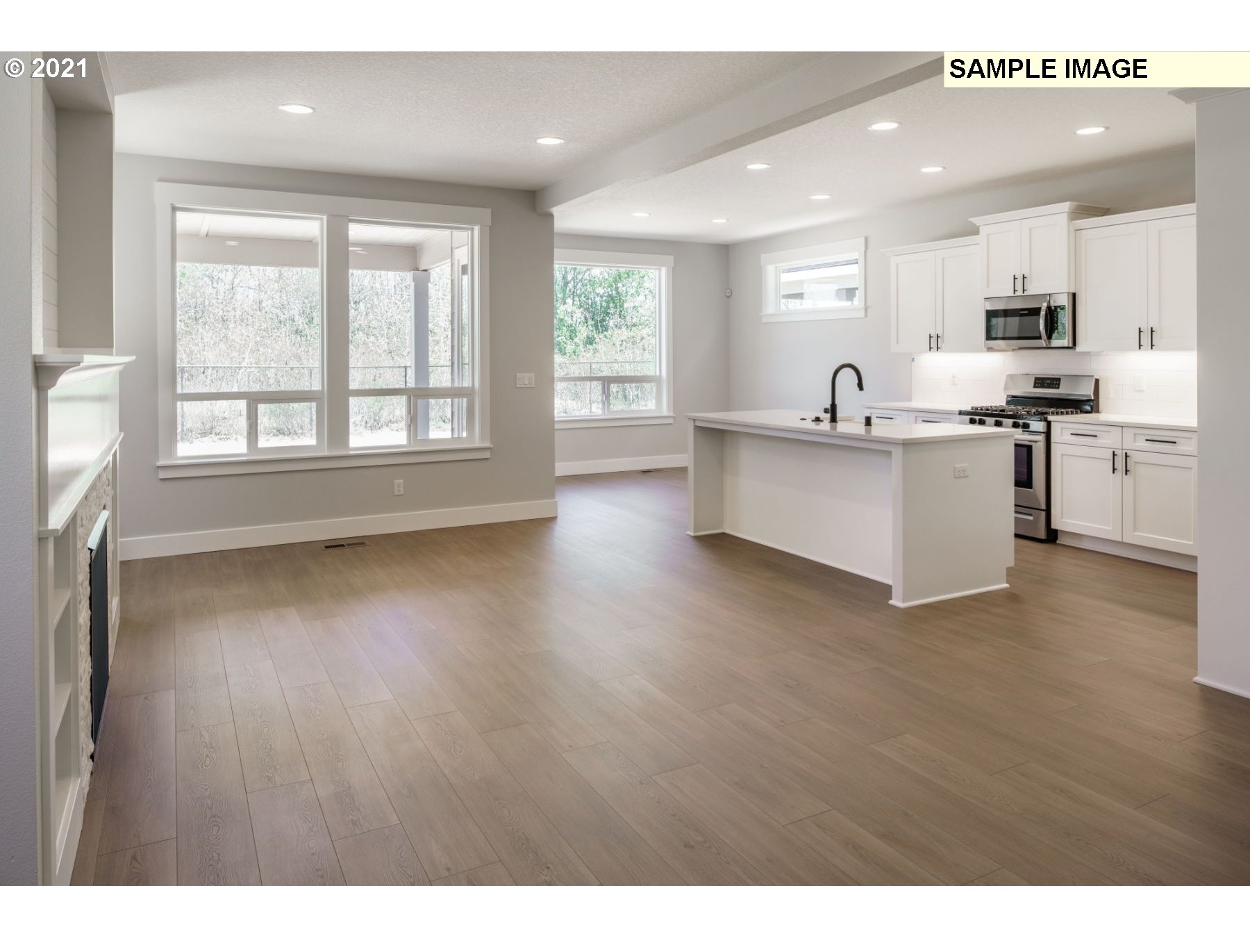 Northeast 109th Circle Vancouver, WA 98682 - Photo 4 of 9 a view of kitchen with wooden floor and electronic appliances