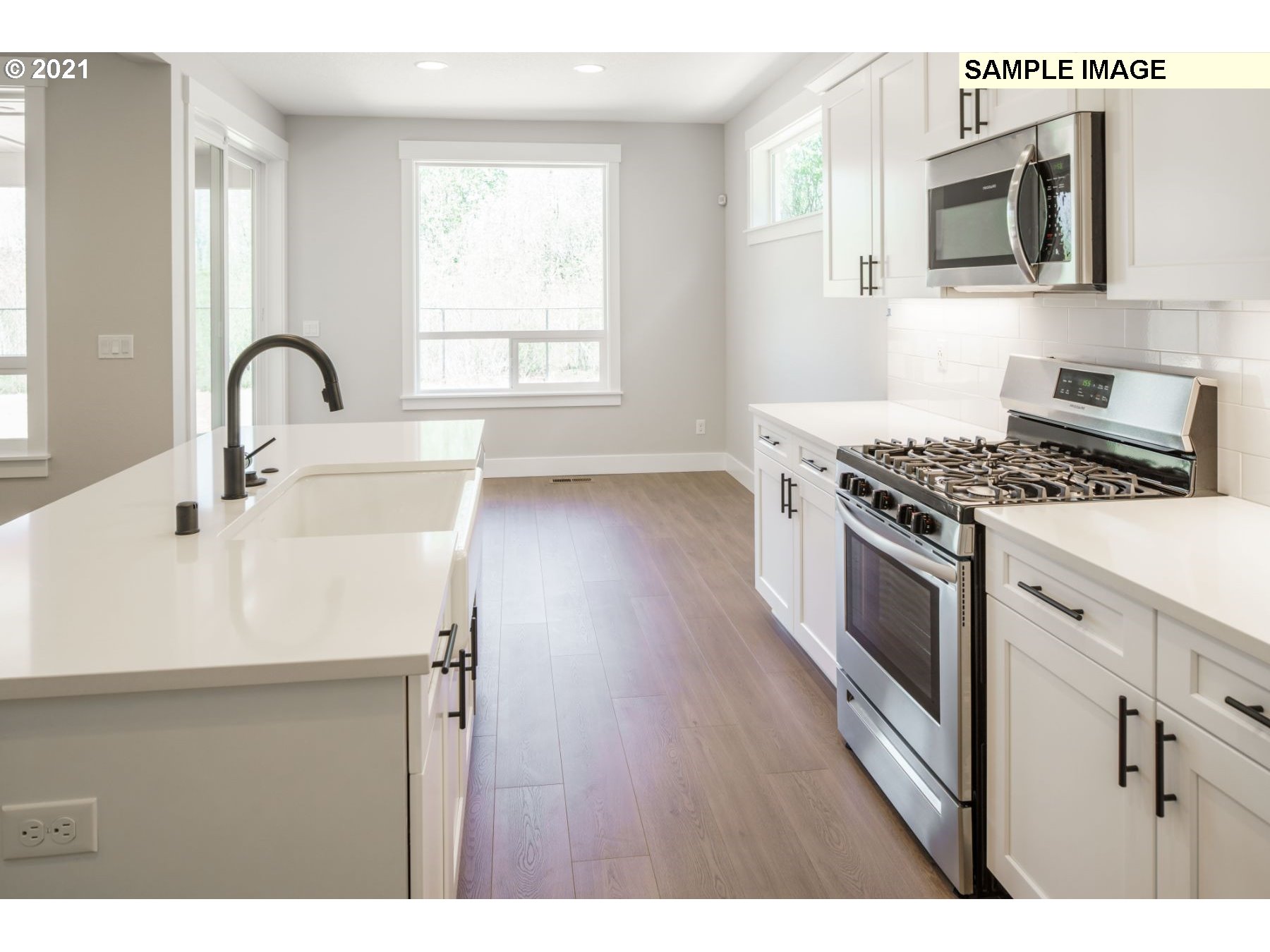 Northeast 109th Circle Vancouver, WA 98682 - Photo 6 of 9 a kitchen with stainless steel appliances granite countertop a stove a sink and a microwave
