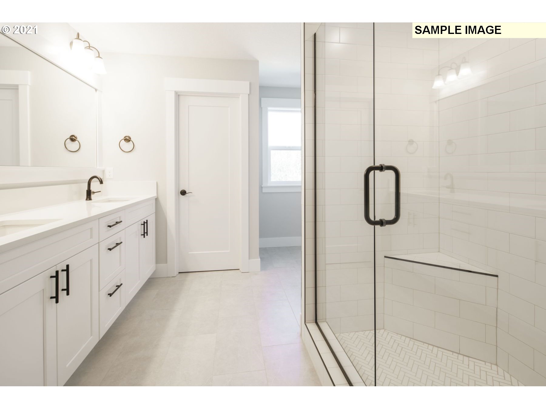 Northeast 109th Circle Vancouver, WA 98682 - Photo 9 of 9 a bathroom with a double vanity sink a mirror and a shower