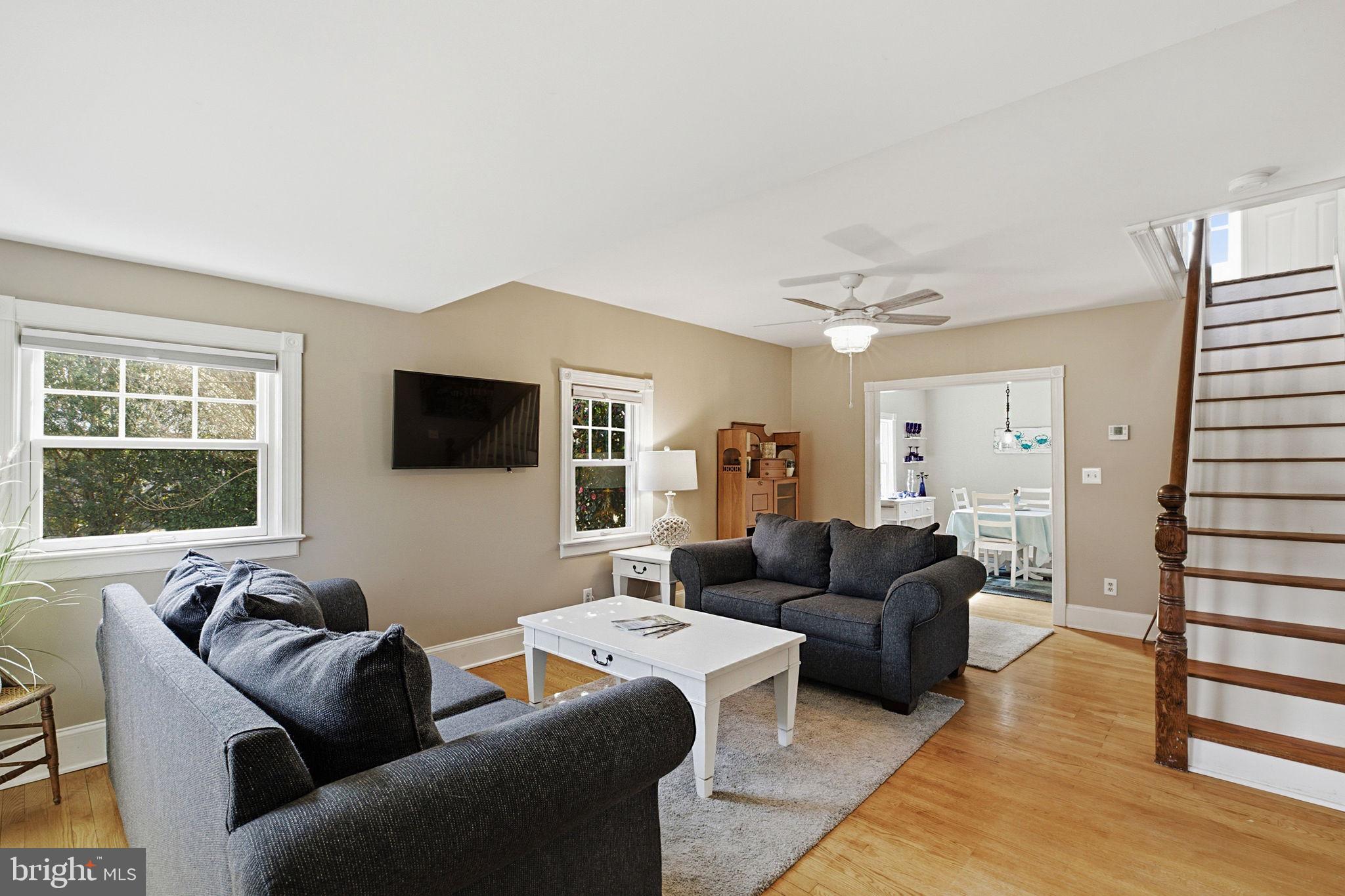 519 Whitehall Road Lancaster, VA 22503 - Photo 12 of 46 a living room with furniture and a flat screen tv