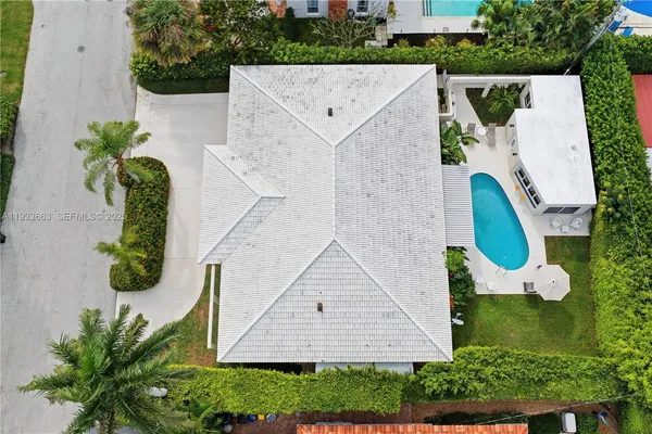 an aerial view of a house with a garden and plants