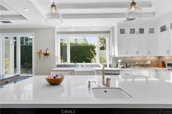 a bathroom with a sink a large mirror and a bathtub