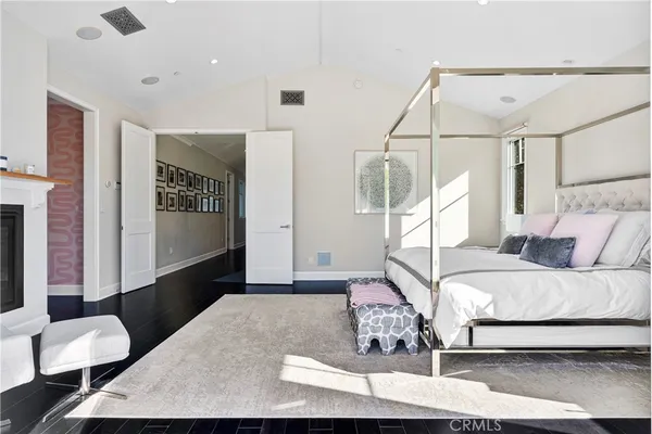 a living room with a bed furniture and a window