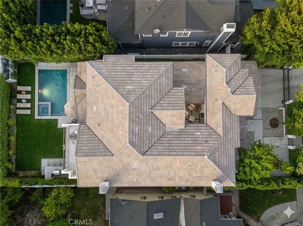 front view of house with a yard and potted plants