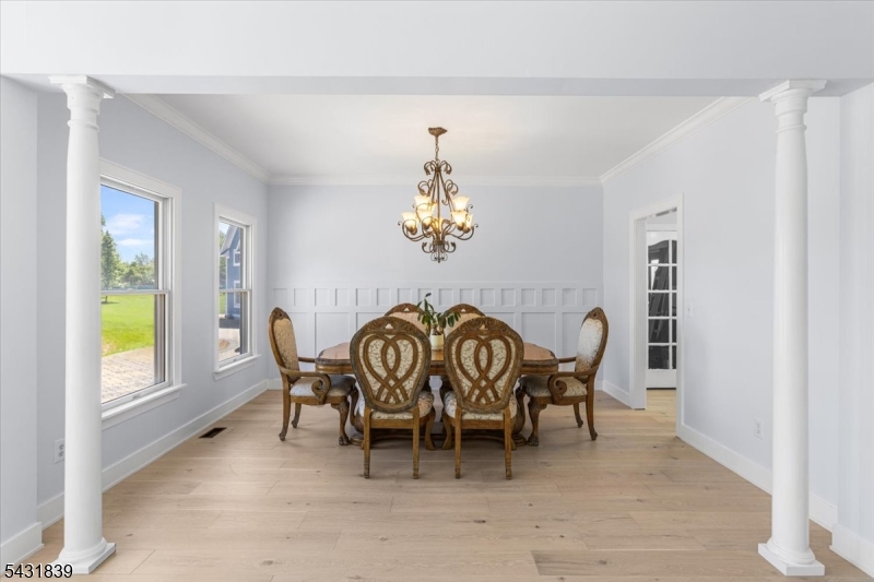 15 Spring Hunter Court Andover, NJ 07821 - Photo 14 of 49 a view of a dining room with furniture window and outside view