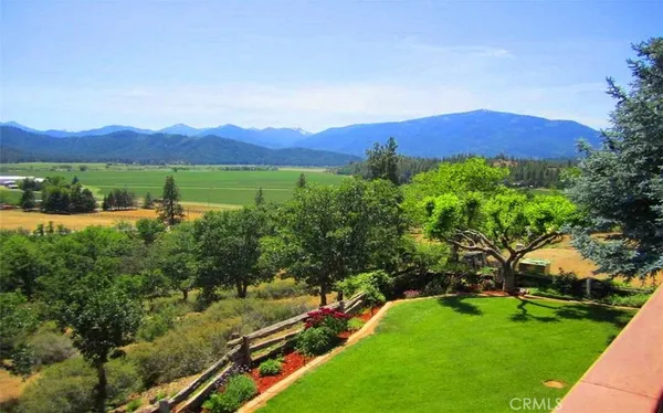 a view of a large body of water with a building in the background