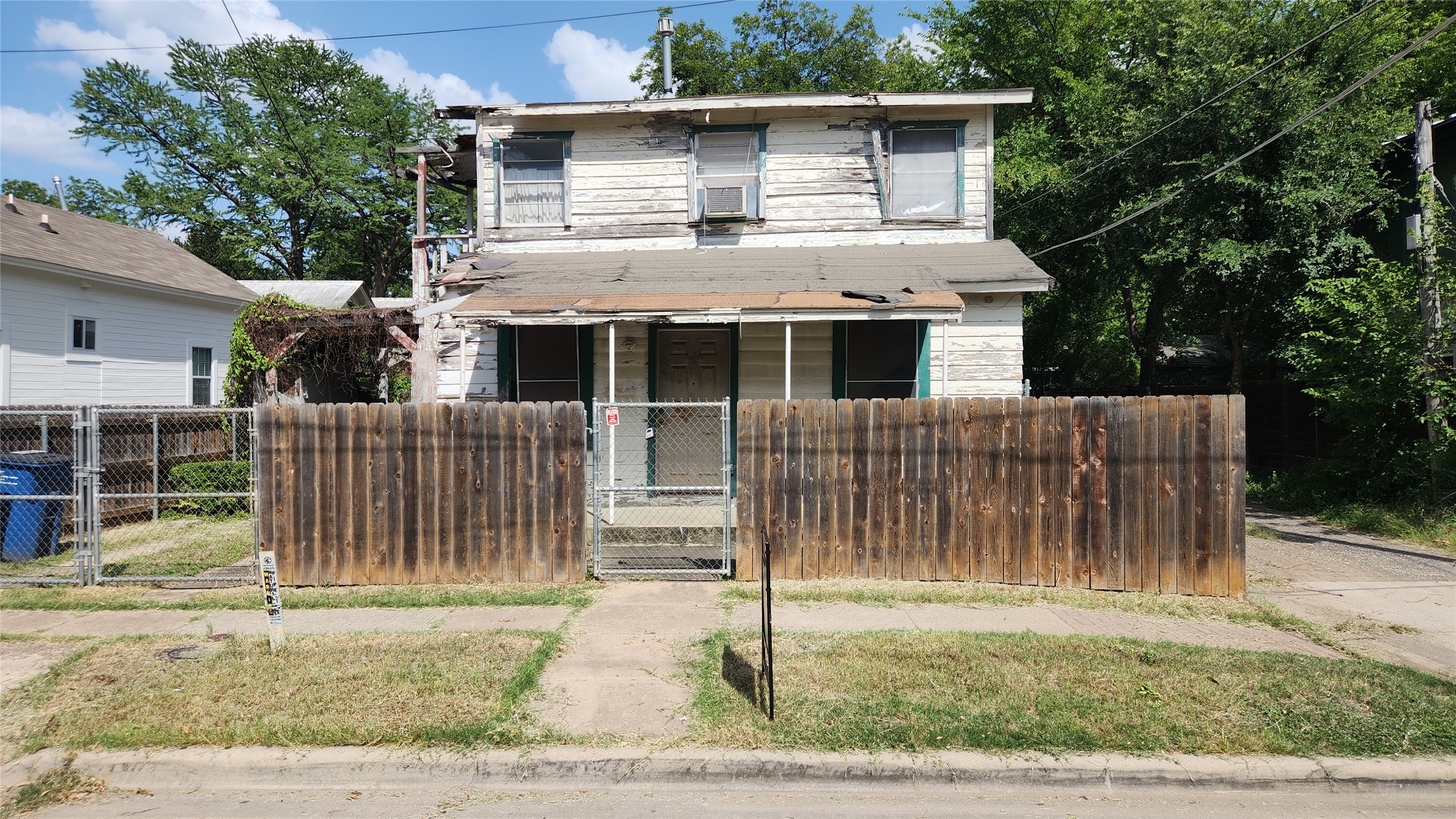 85 Navasota Street Austin, TX 78702 - Photo 1 of 1 View of front of home featuring a gate, a porch, and a fenced front yard