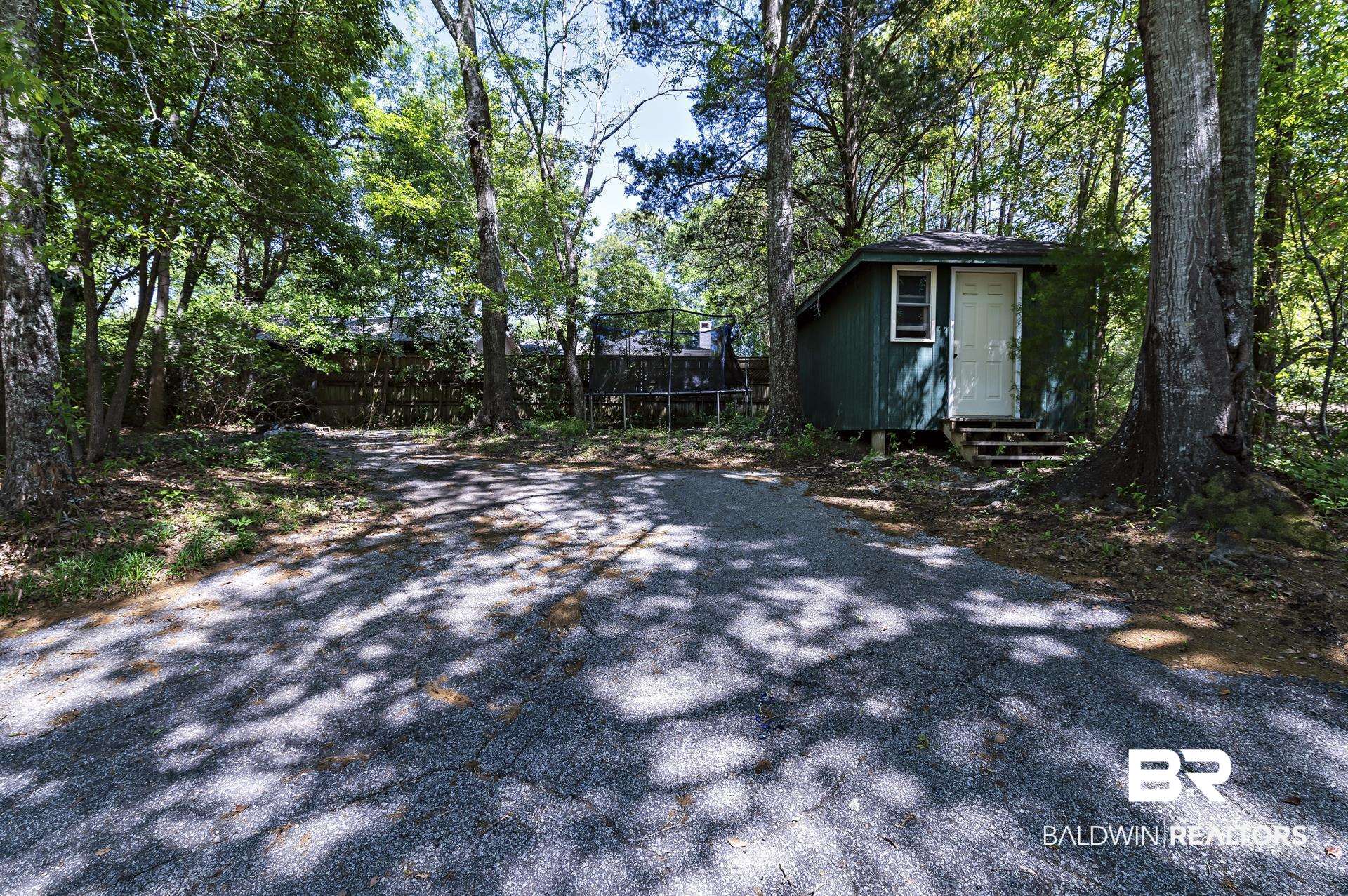 707 Johnson Avenue Fairhope, AL 36532 - Photo 13 of 38 View of street featuring entry steps and driveway