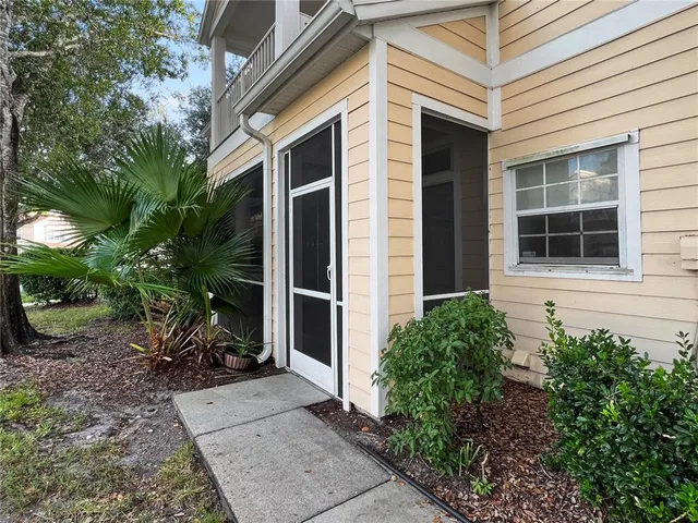 a view of house with backyard space and garden