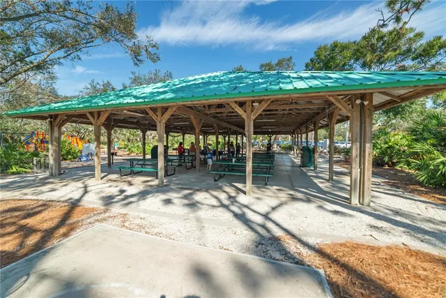 a view of a park with large trees