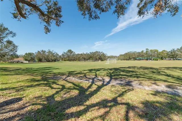 a view of a lake with houses in the background