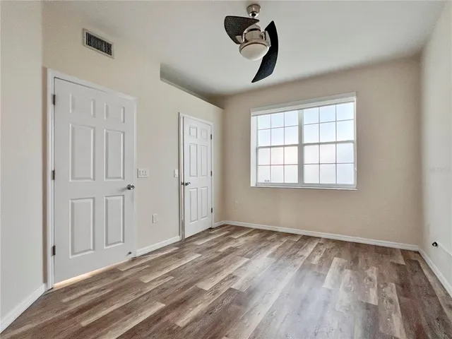 a view of empty room with windows
