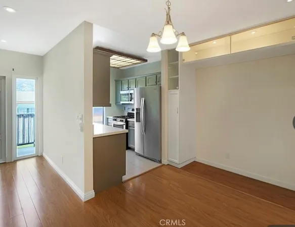 a view of a kitchen cabinets and wooden floor
