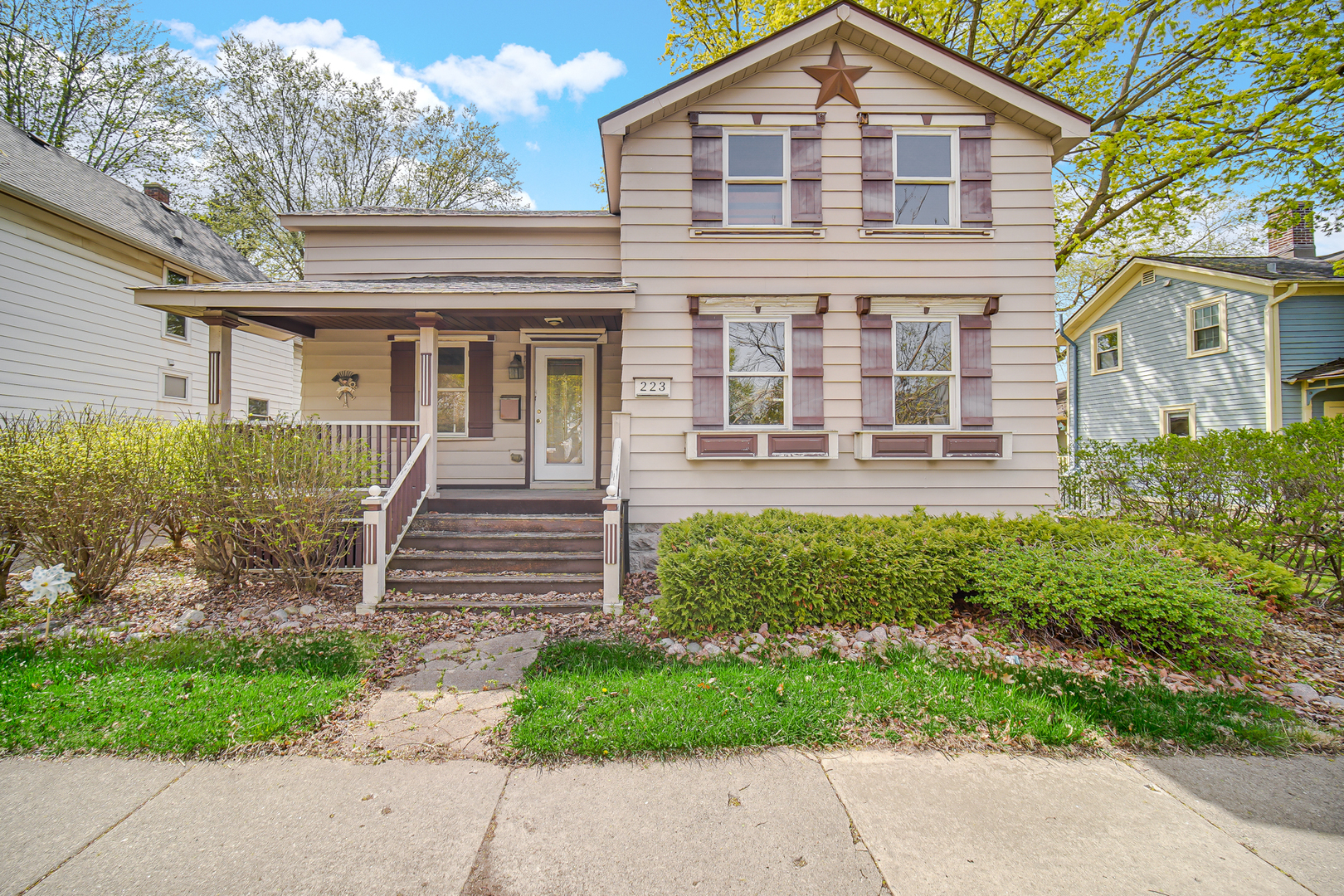 front view of a house with a yard