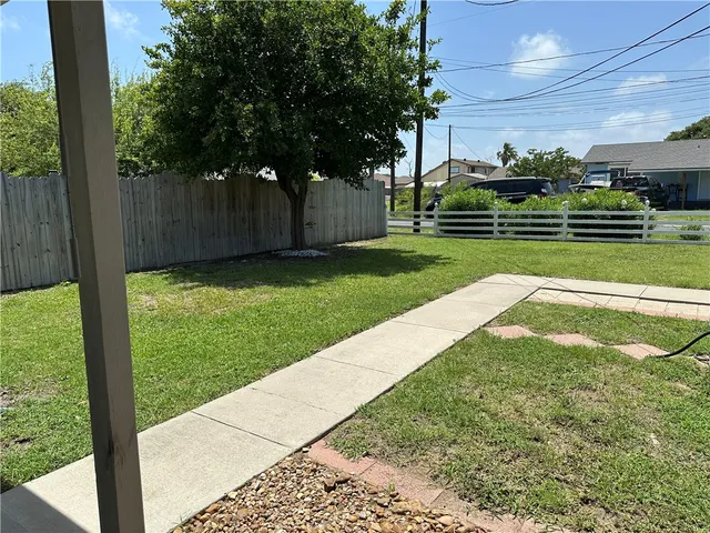 a view of backyard with green space
