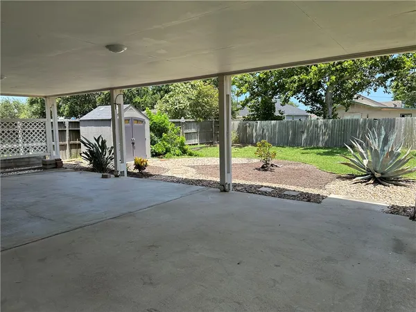 a view of an entryway with a floor to ceiling window