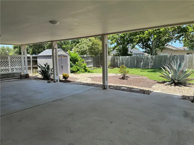a view of an entryway with a floor to ceiling window