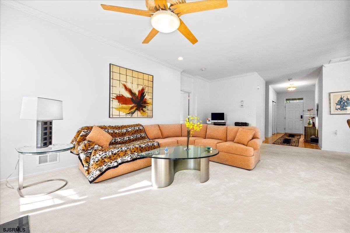 1 Butler Road Egg Harbor Township, NJ 08234 - Photo 14 of 39 a living room with furniture a couch and a chandelier