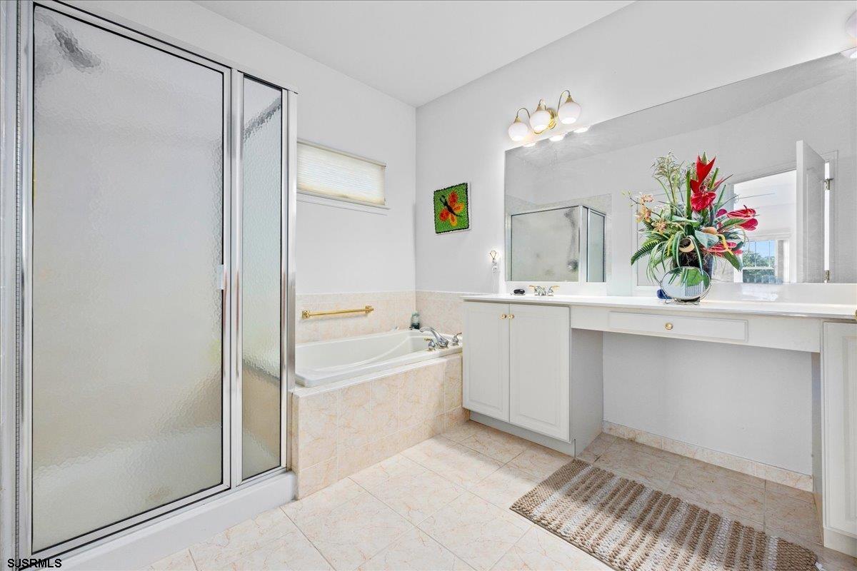 1 Butler Road Egg Harbor Township, NJ 08234 - Photo 17 of 39 a bathroom with a tub sink and mirror