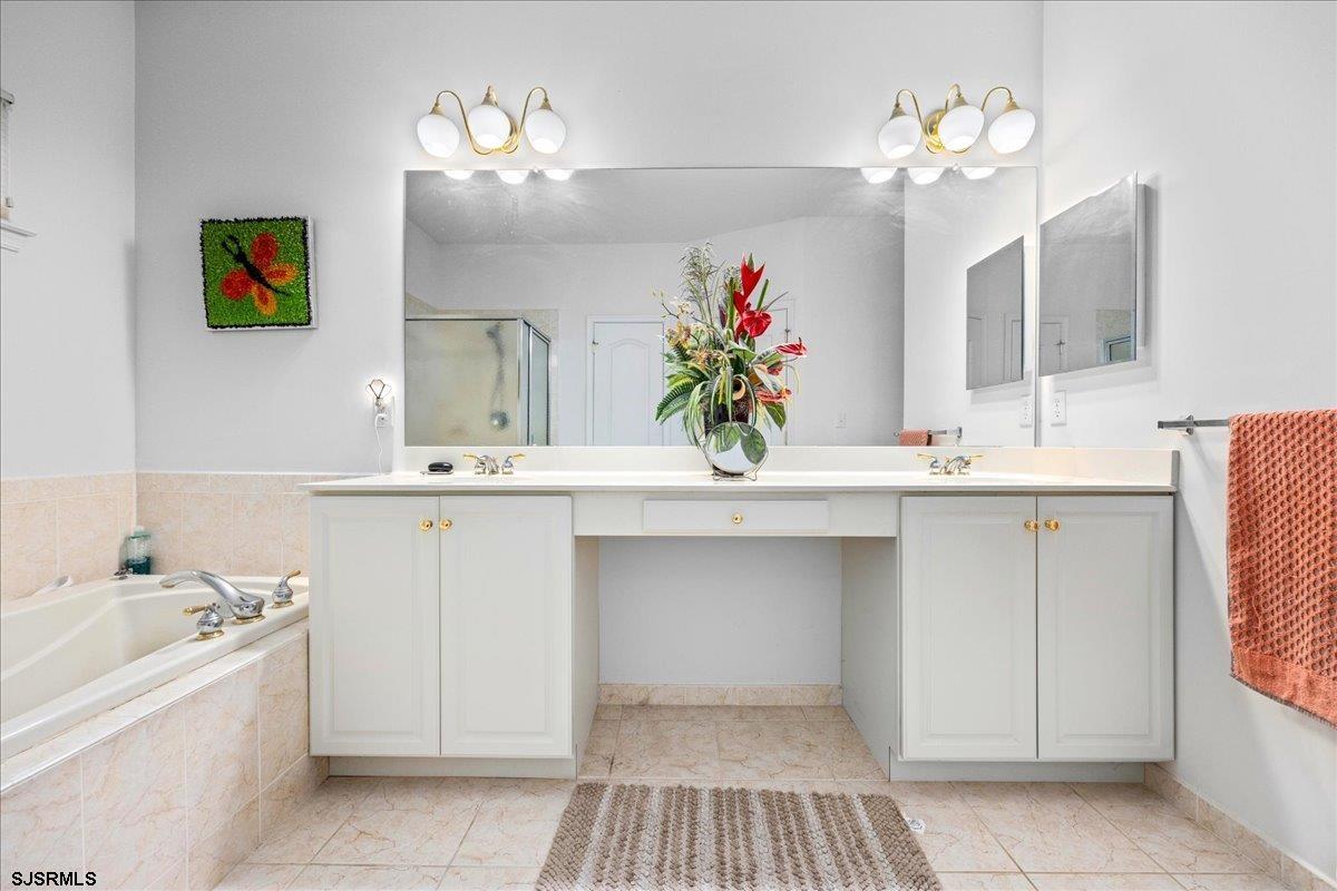 1 Butler Road Egg Harbor Township, NJ 08234 - Photo 18 of 39 a bathroom with a sink vanity and a mirror