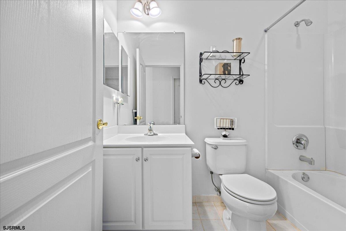 1 Butler Road Egg Harbor Township, NJ 08234 - Photo 19 of 39 a bathroom with a sink a toilet and mirror