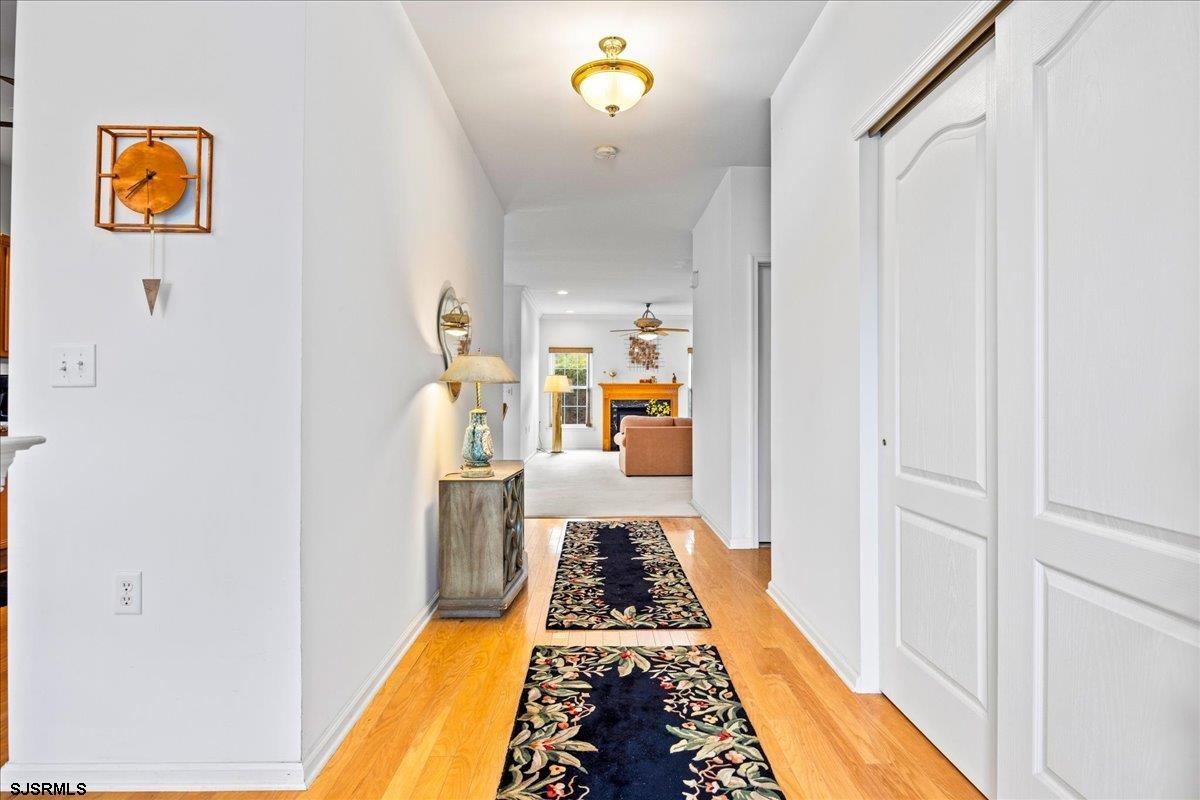 1 Butler Road Egg Harbor Township, NJ 08234 - Photo 3 of 39 a hallway with a dining table and chairs