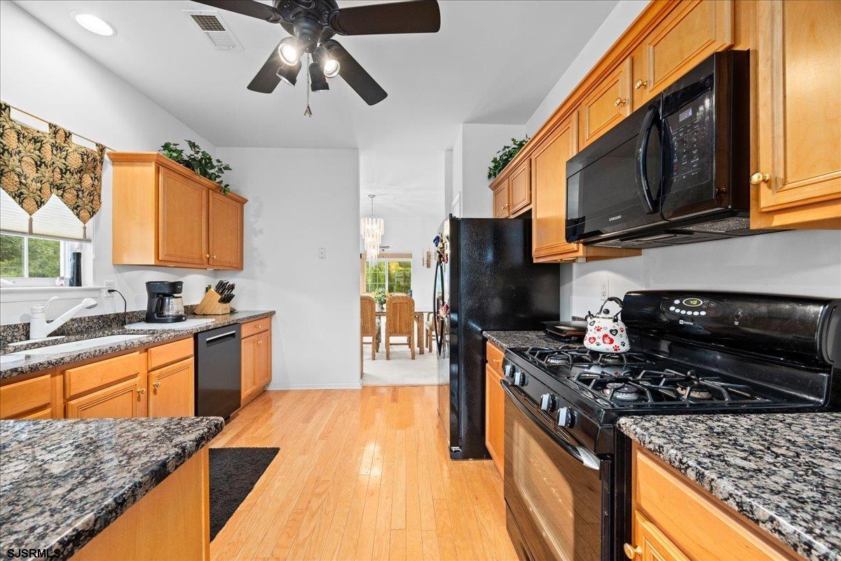 1 Butler Road Egg Harbor Township, NJ 08234 - Photo 5 of 39 a kitchen with stainless steel appliances granite countertop a sink stove and microwave