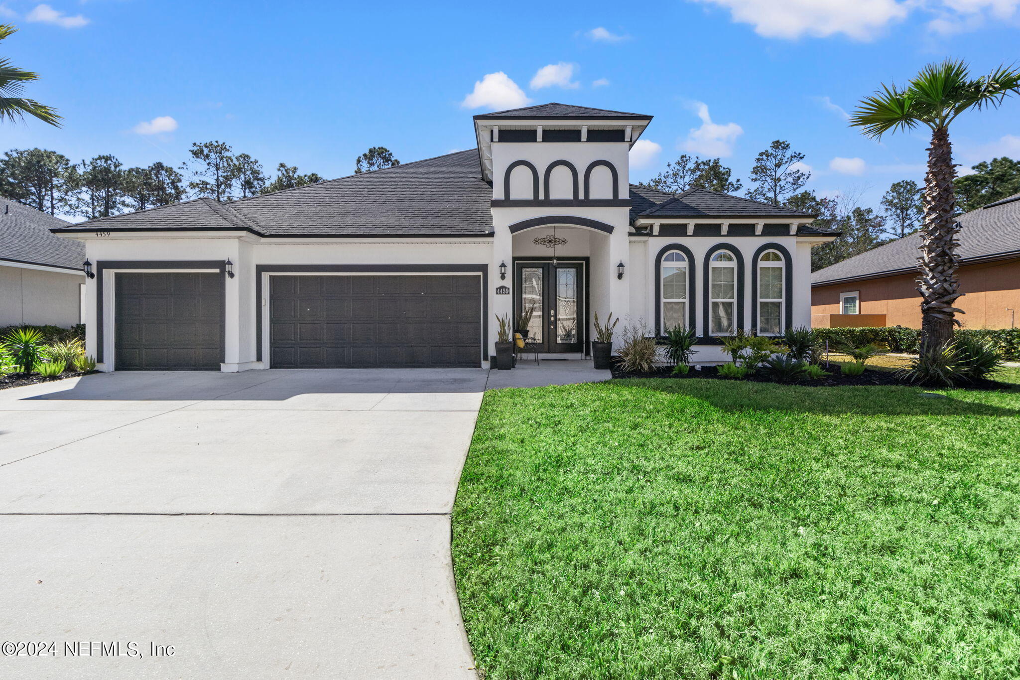 4459 Quail Hollow Road Orange Park, FL 32065 - Photo 1 of 37 a front view of a house with garden