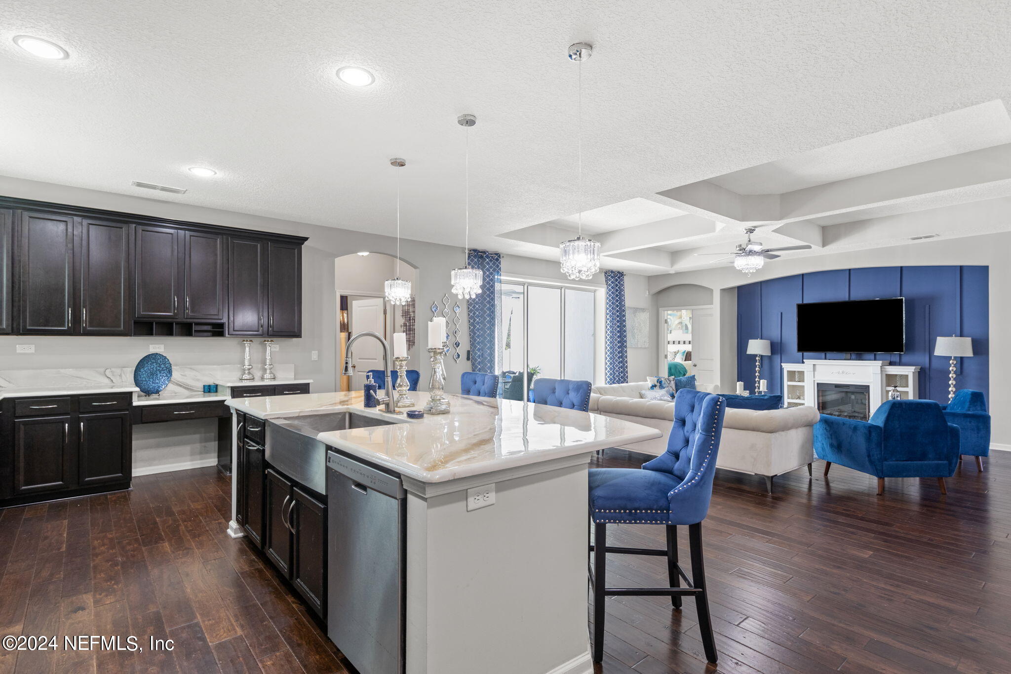 4459 Quail Hollow Road Orange Park, FL 32065 - Photo 14 of 37 a open kitchen with stainless steel appliances granite countertop a stove top oven a sink dishwasher a dining table and chairs with wooden floor