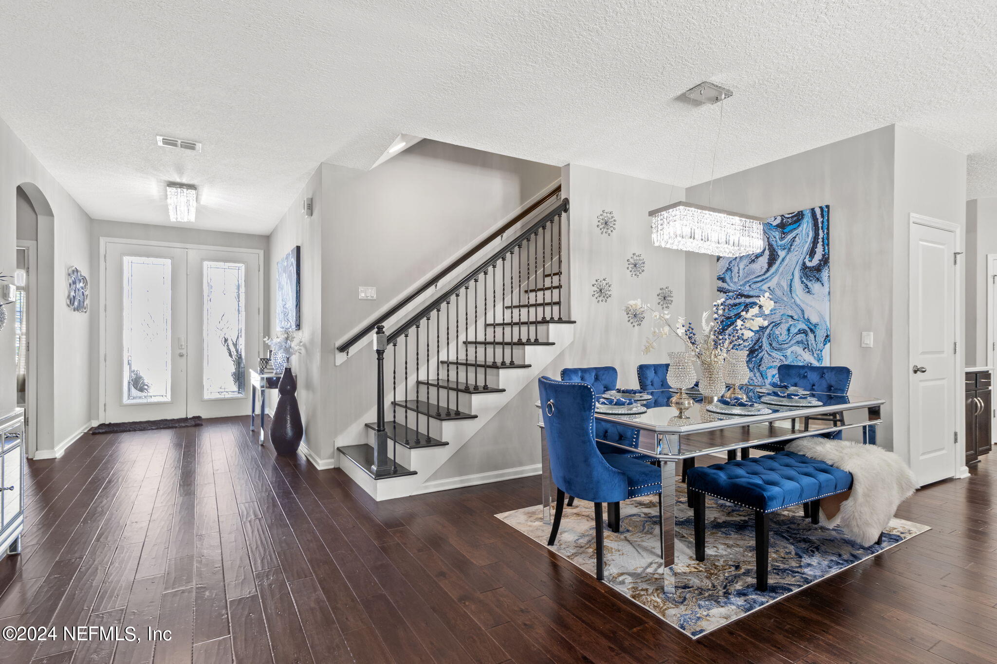 4459 Quail Hollow Road Orange Park, FL 32065 - Photo 16 of 37 a dining room with furniture wooden floor and a rug