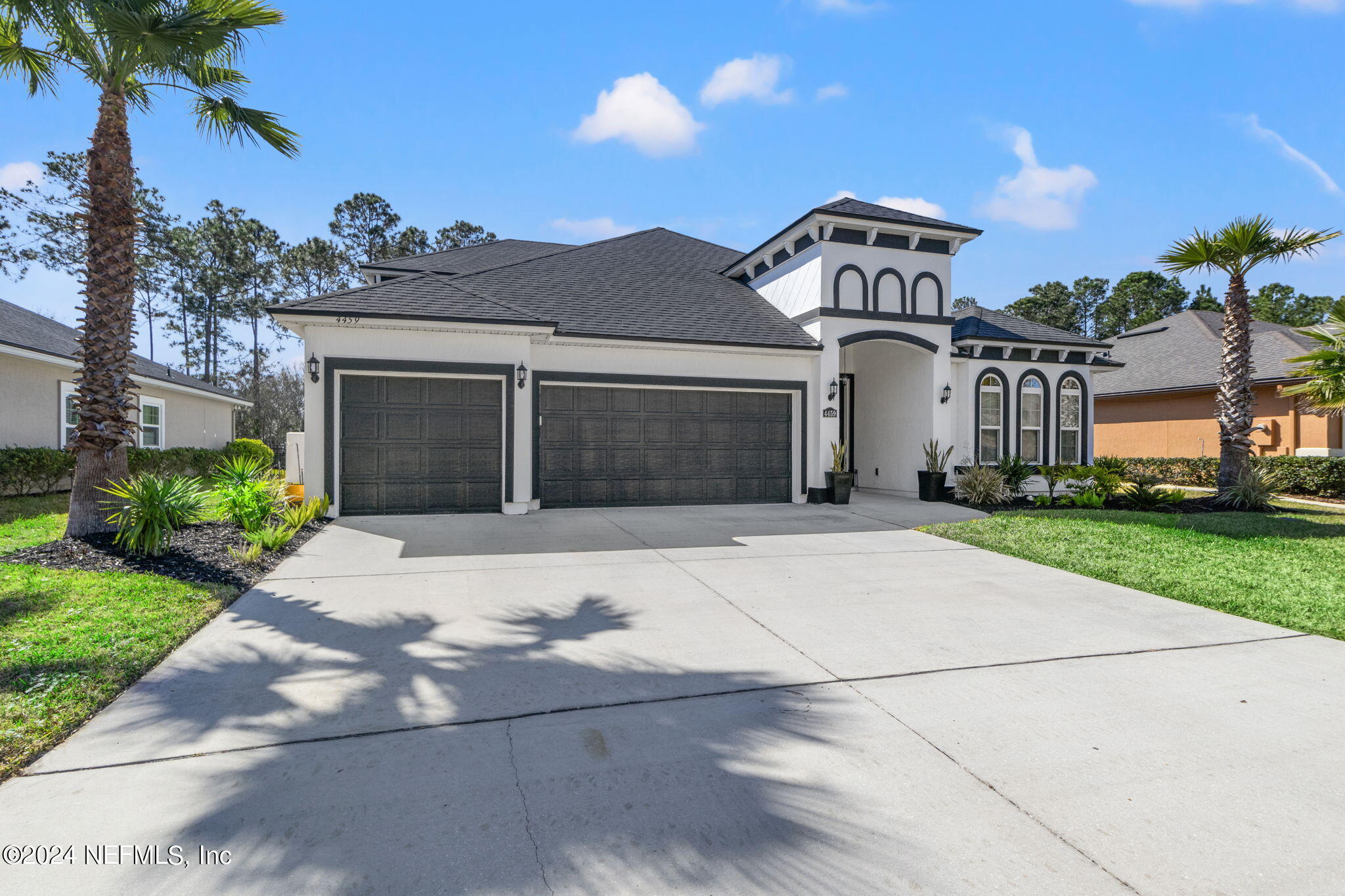 4459 Quail Hollow Road Orange Park, FL 32065 - Photo 2 of 37 a front view of a house with a yard and garage