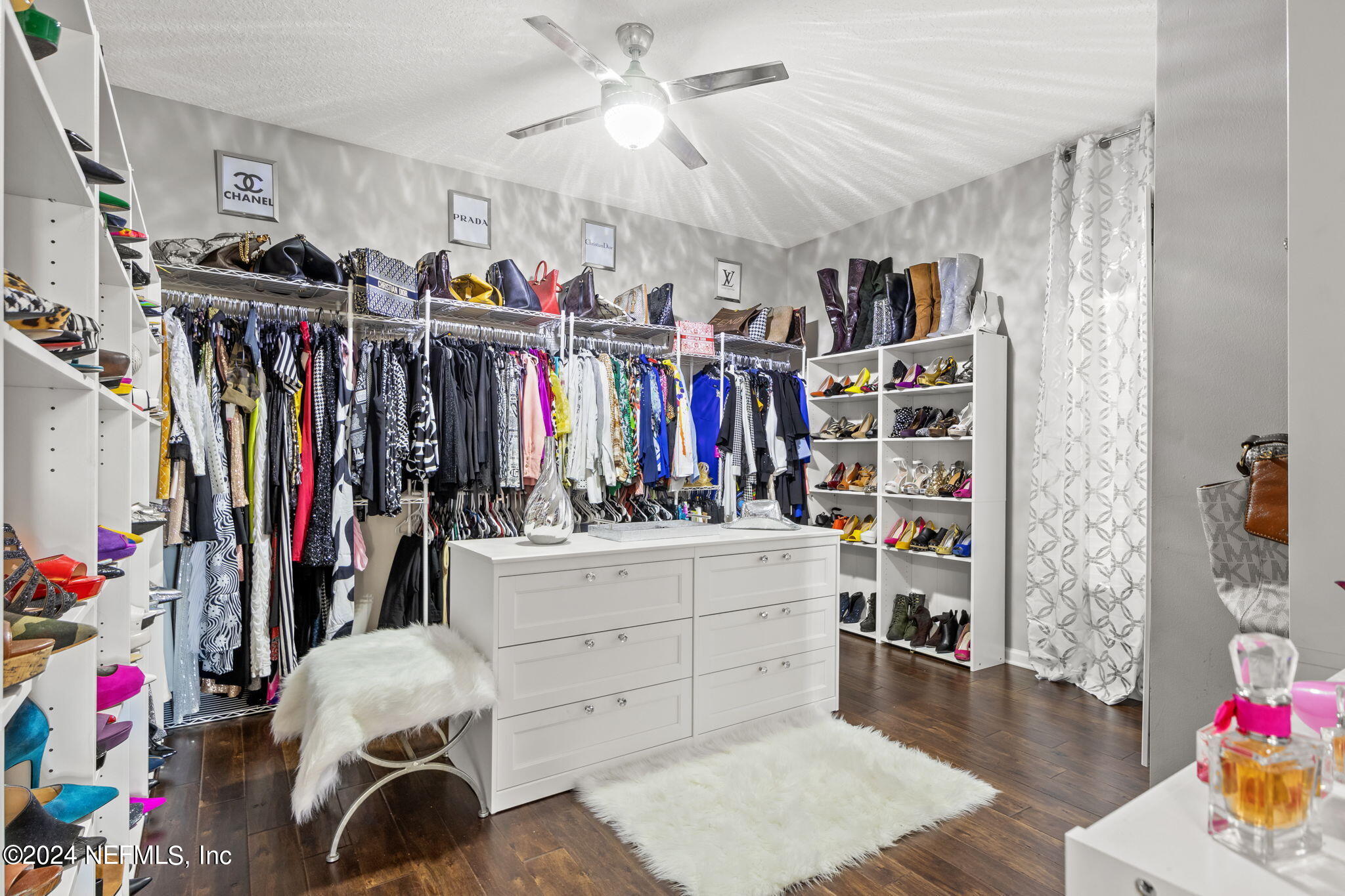 4459 Quail Hollow Road Orange Park, FL 32065 - Photo 21 of 37 a view of walk in closet with clothes and shoes