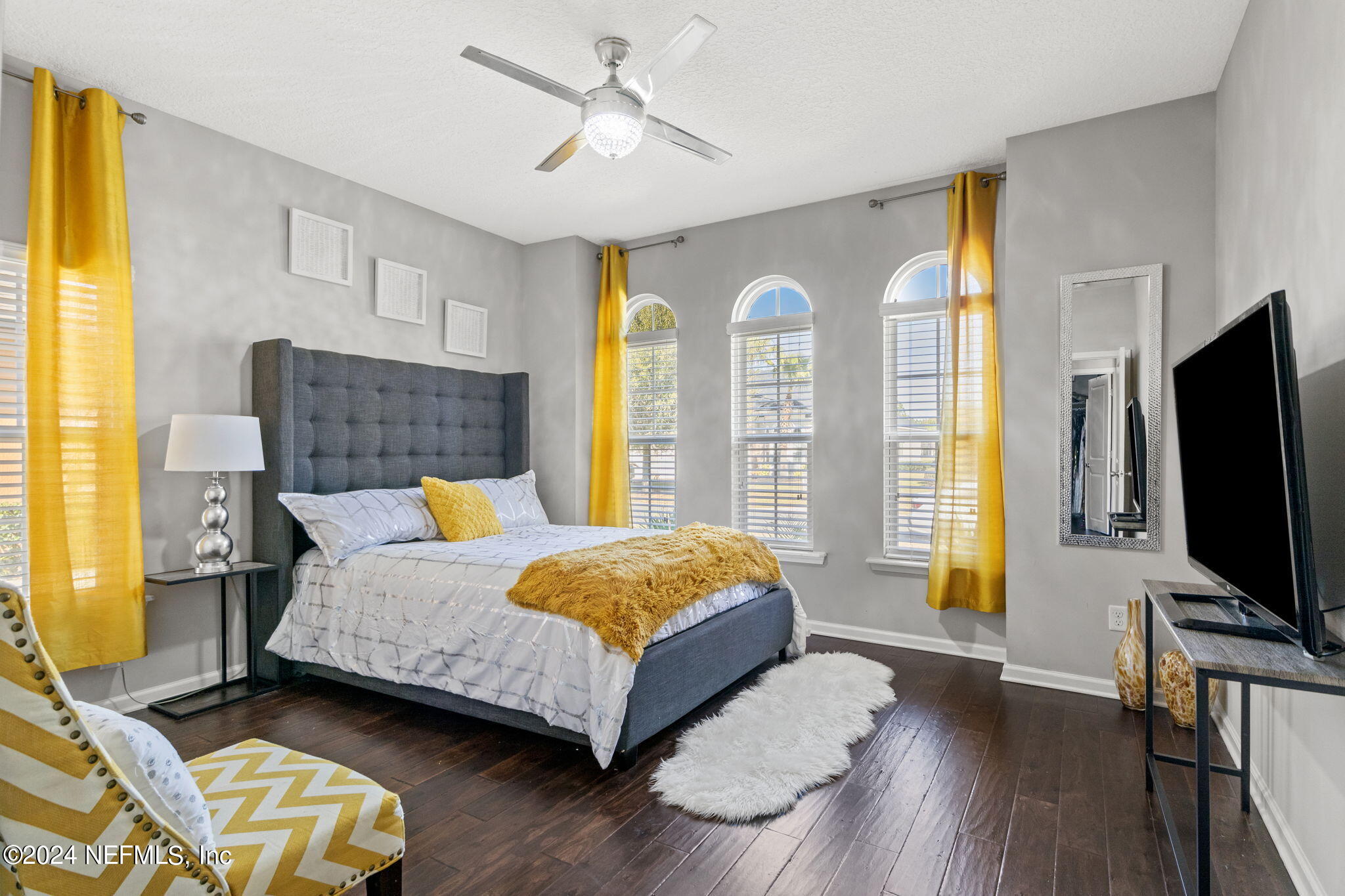 4459 Quail Hollow Road Orange Park, FL 32065 - Photo 22 of 37 a bedroom with a bed and wooden floor