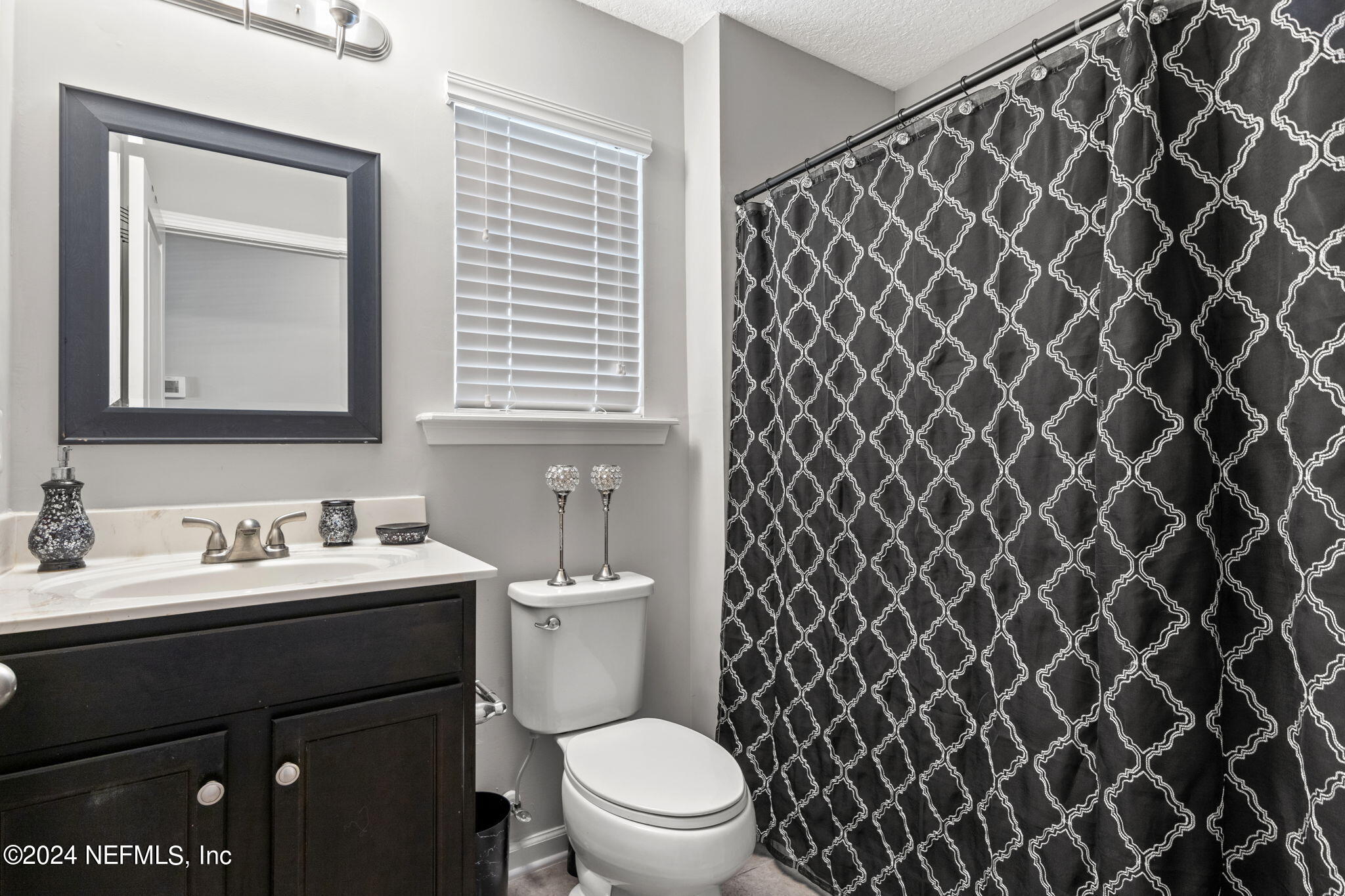 4459 Quail Hollow Road Orange Park, FL 32065 - Photo 26 of 37 a bathroom with a sink and a toilet