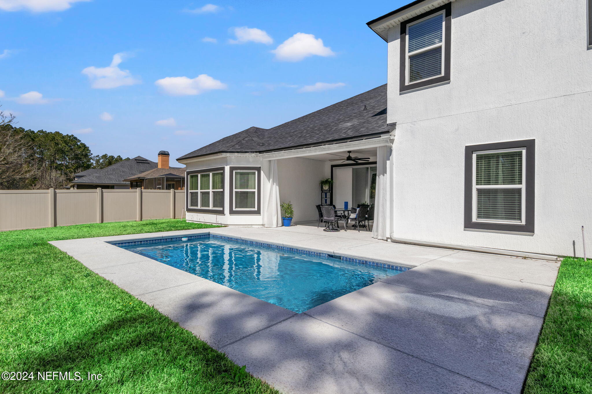 4459 Quail Hollow Road Orange Park, FL 32065 - Photo 30 of 37 a view of a house with swimming pool and yard