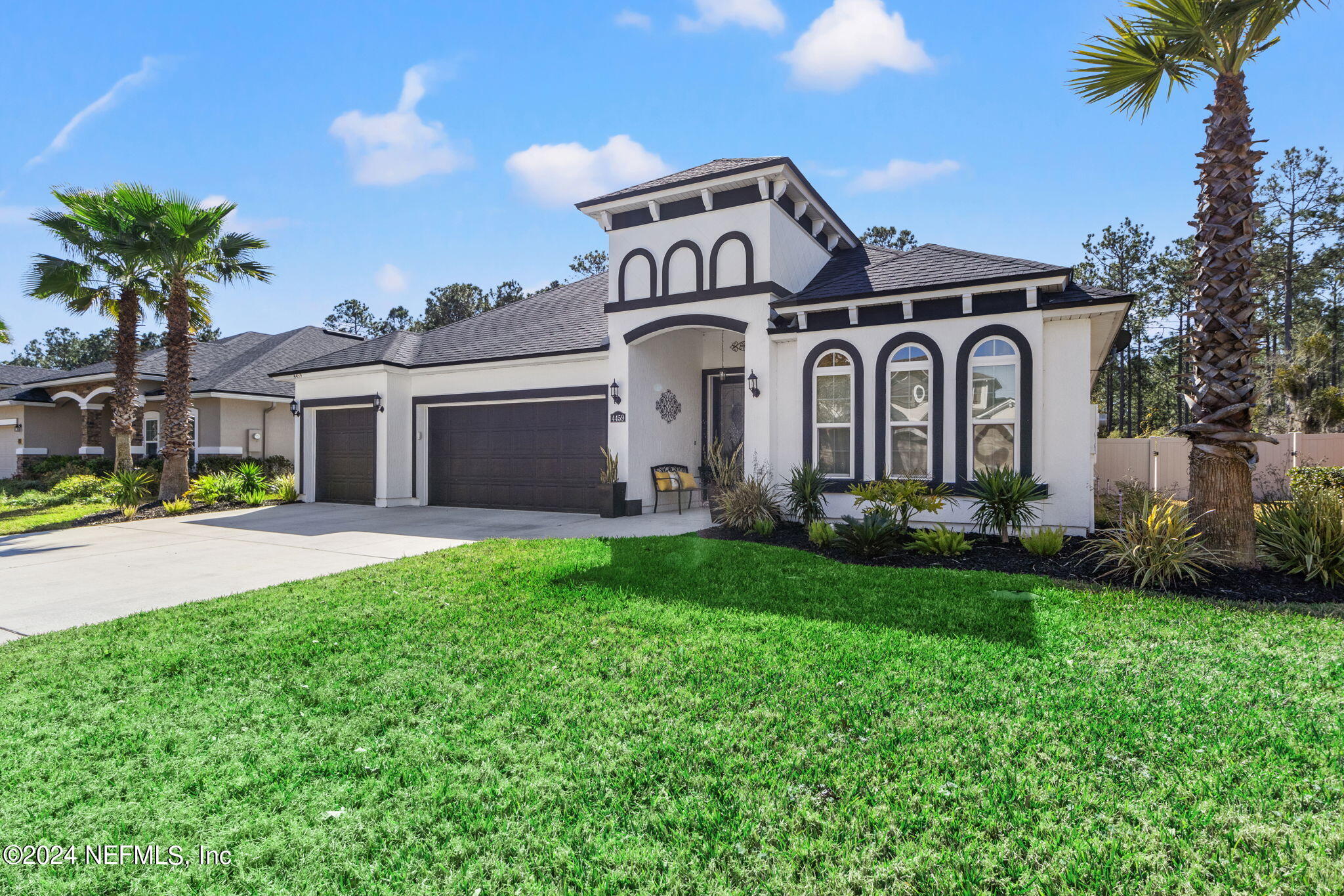 4459 Quail Hollow Road Orange Park, FL 32065 - Photo 3 of 37 a front view of a house with garden