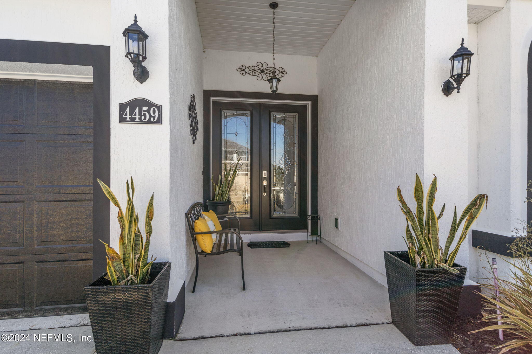 4459 Quail Hollow Road Orange Park, FL 32065 - Photo 4 of 37 a view of an entryway with a potted plant