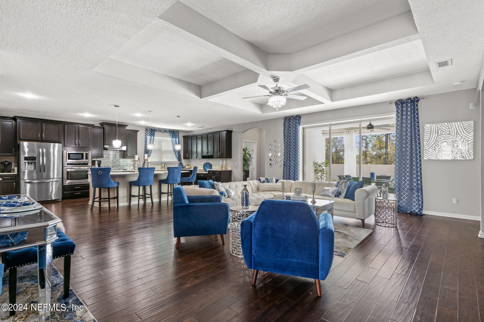 4459 Quail Hollow Road Orange Park, FL 32065 - Photo 5 of 37 a living room with lots of furniture dining table and wooden floor