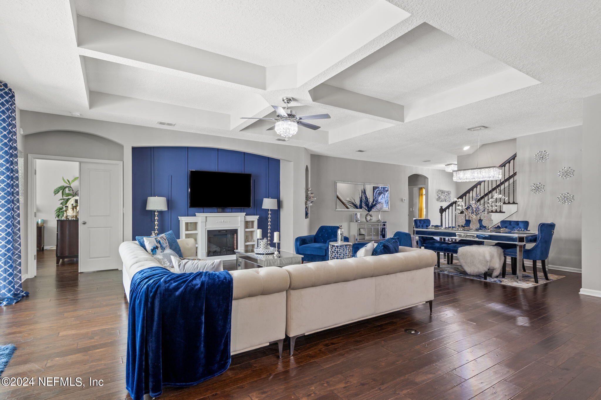 4459 Quail Hollow Road Orange Park, FL 32065 - Photo 7 of 37 a living room with furniture a flat screen tv and kitchen view