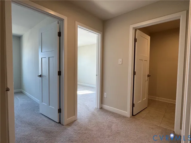 an empty room that has a mirror in it