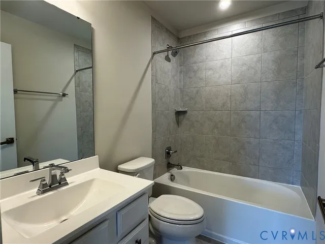 a bathroom with a sink a toilet and a bathtub