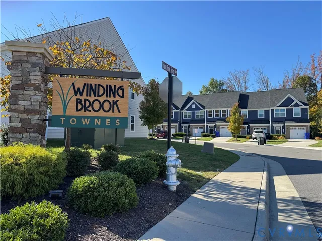 a view of front of house with sign board