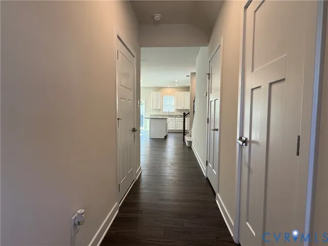 a view of a hallway with the wooden floor