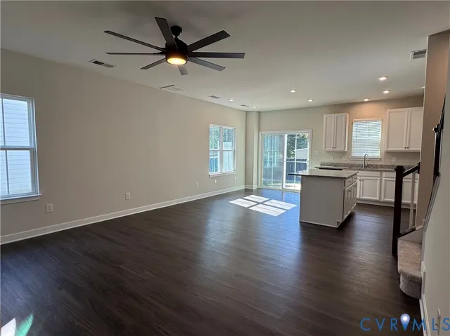 an open kitchen with sink and cabinet
