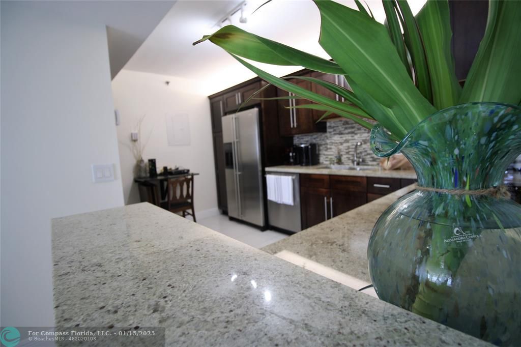 9341 Collins Avenue, Unit 1003 Surfside, FL 33154 - Photo 19 of 24 a view of kitchen with sink and natural light