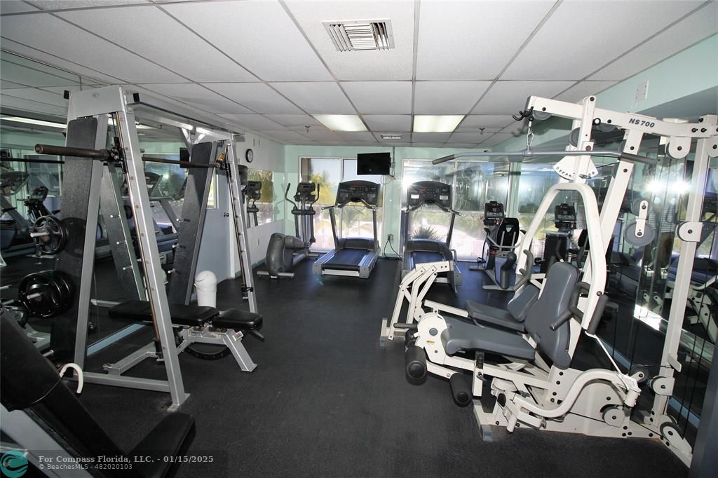 9341 Collins Avenue, Unit 1003 Surfside, FL 33154 - Photo 23 of 24 a view of a room with gym equipment
